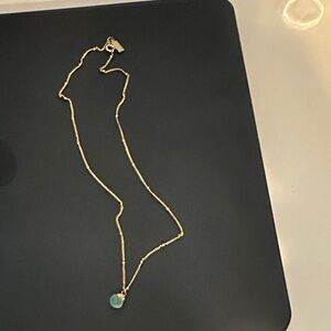 Elegant Gold Necklace with Blue Pendant